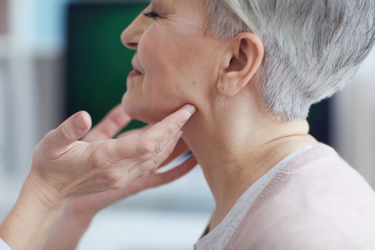 woman having face examined