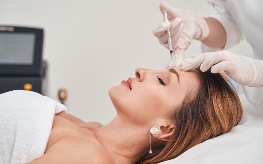 woman getting botox injection in face