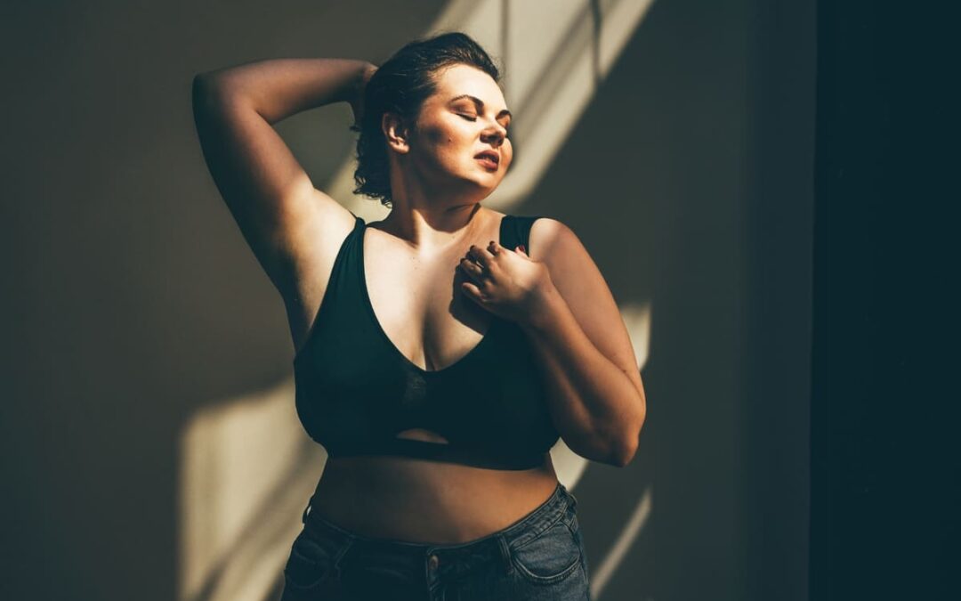 woman standing in sun ray with confidence