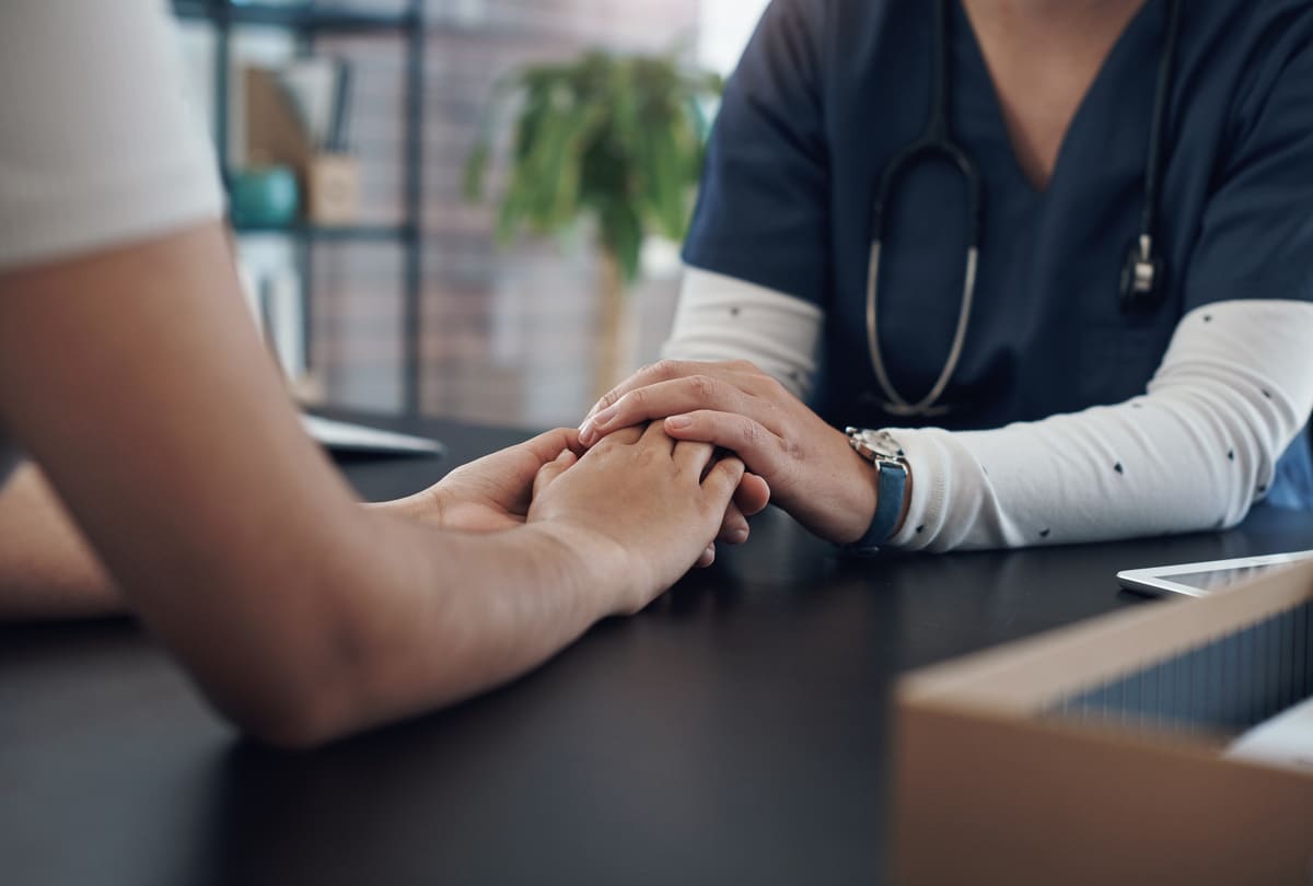 people holding hands in support