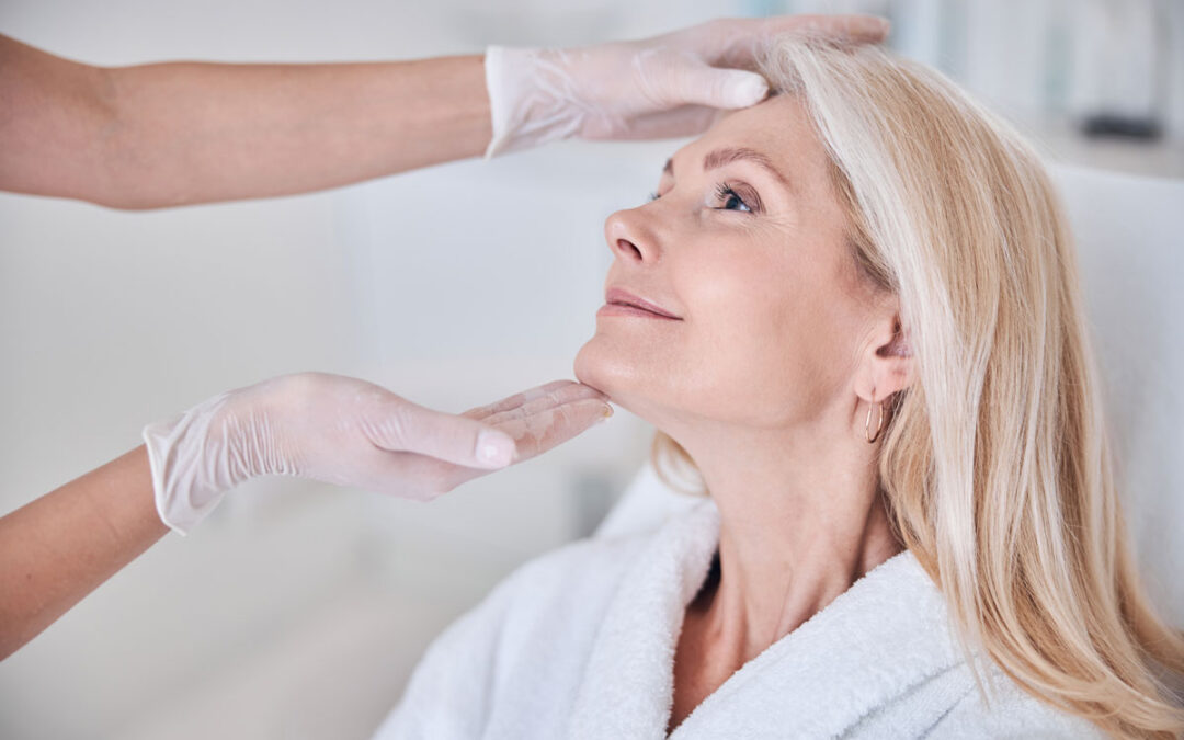 Facelift in Napa CA consultation with surgeon examining jawline and neck for natural facial contour assessment