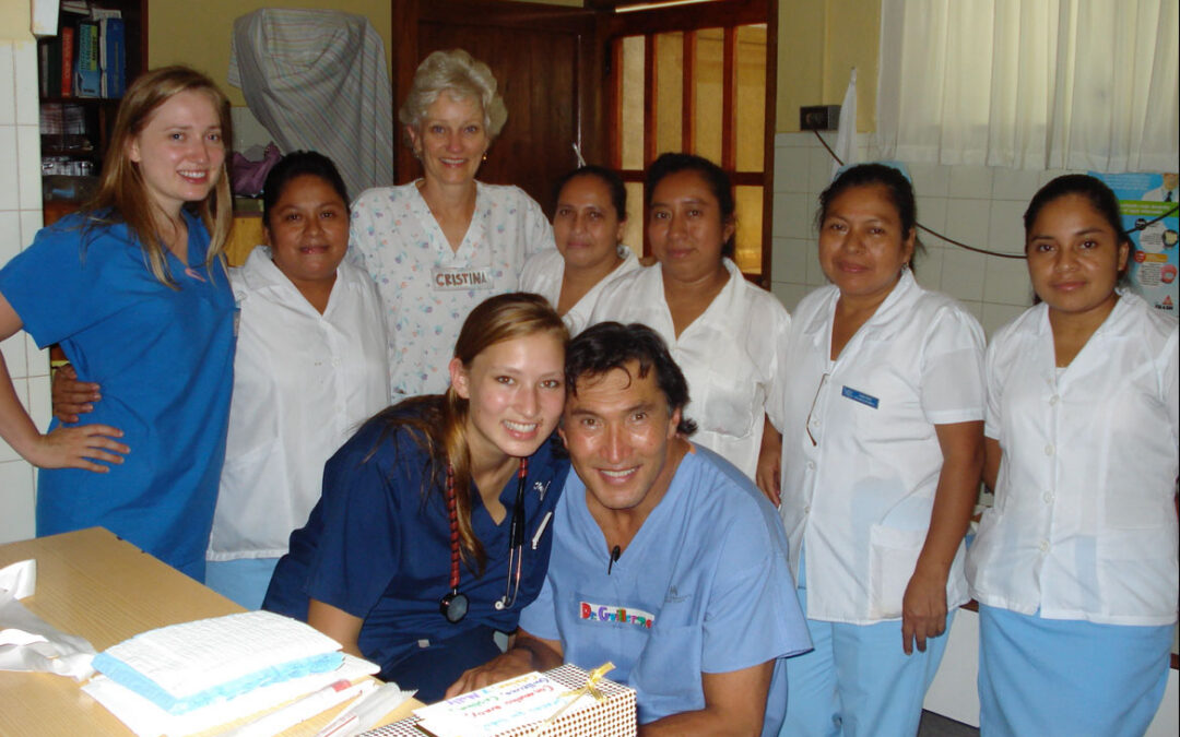 Dr. William McClure, a plastic surgeon, with his wife, daughters, and medical colleagues during humanitarian work